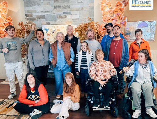 This photo was taken in November 2025 at FRIENDS of Broomfield, Inc. in Broomfield, Colorado. Pictured are Sara Hoffman, Managing Partner, and Aaron Hoffman, Managing Partner, alongside FRIENDS participants during the organization’s Friendsgiving celebration.