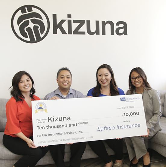 FIA Insurance and Kizuna check presentation