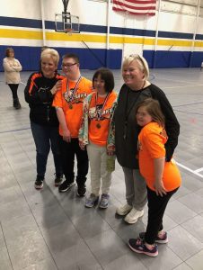 Group photo after a basketball game for youth with disabilities.